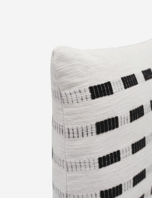 Corner of the Bertu onyx black pillow with a woven dash pattern by Bolé Road Textiles