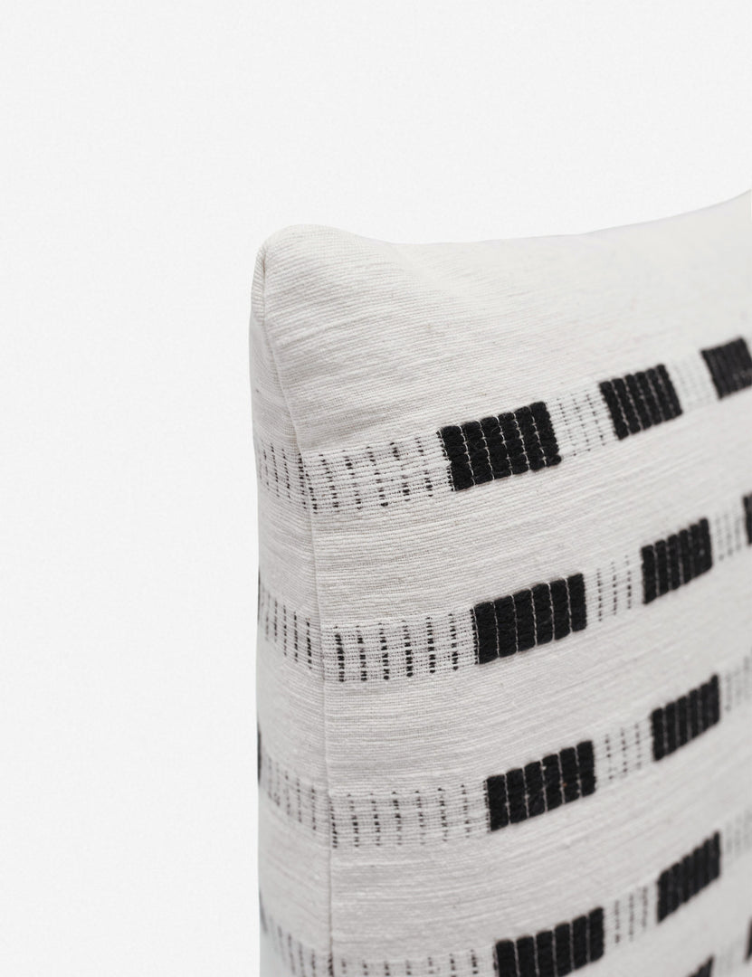 #color::onyx | Corner of the Bertu onyx black pillow with a woven dash pattern by Bolé Road Textiles