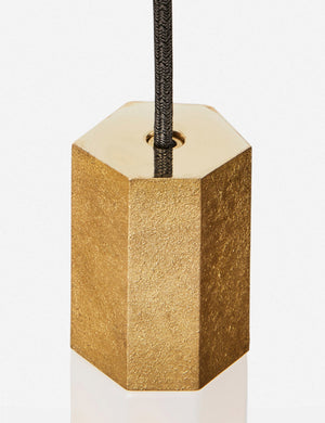 Close-up of the sand casted brass hardware on the Basalt slender hexagonal 9-light pendant light by tala