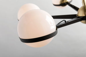 Close-up of the spherical lighting fixtures on the Adeline black and brass retro chandelier