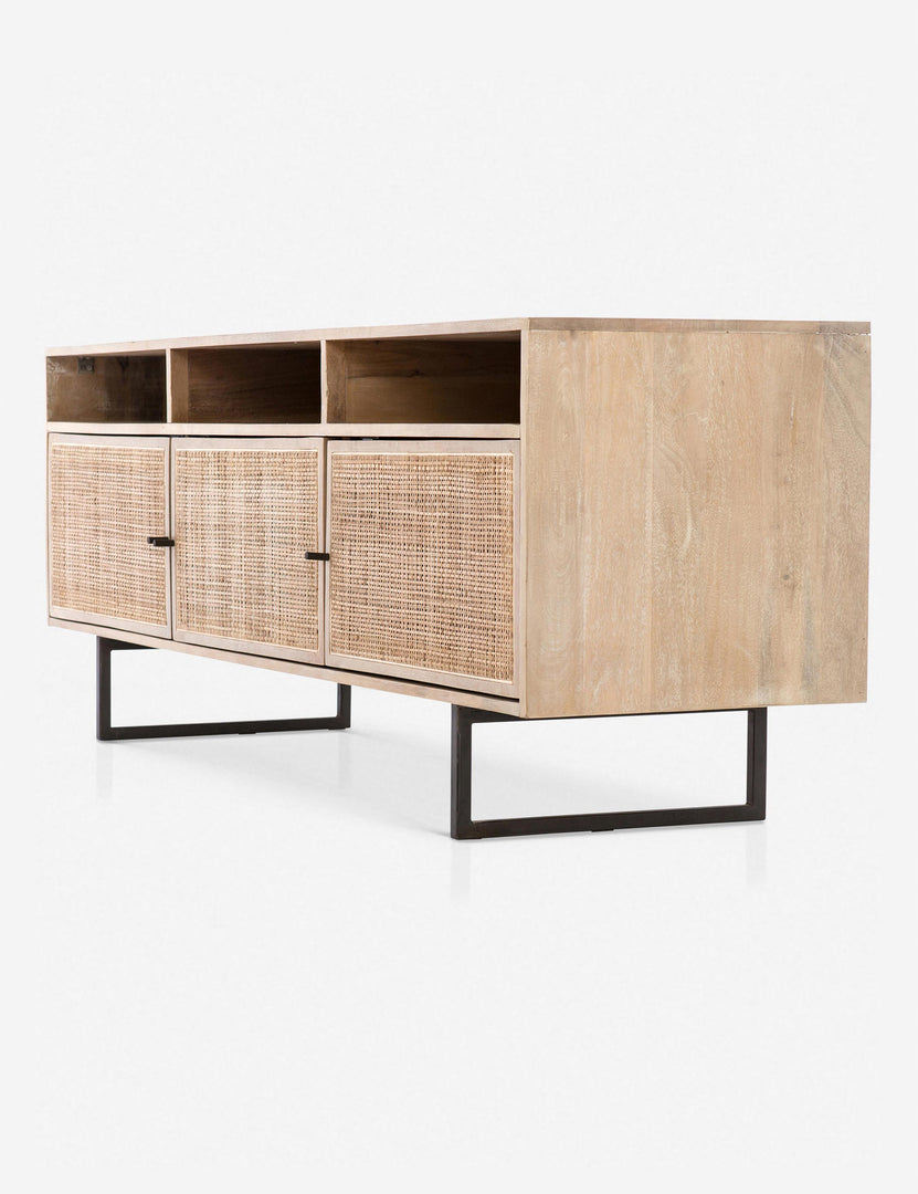 #color::natural | Angled view of the Hannah natural mango wood media console with cane doors.