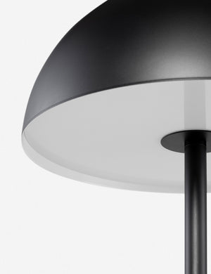 Close-up of the acrylic light diffuser on the Luz black dome table  lamp