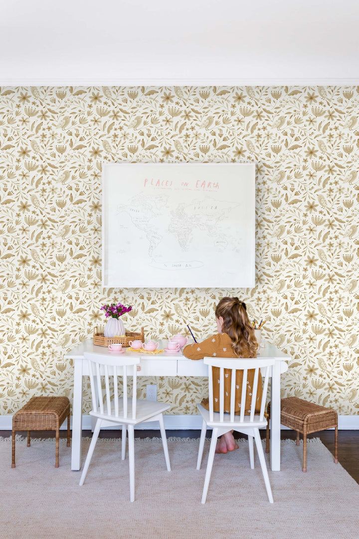 | The Garden Birds Wallpaper by Rylee + Cru is in a kid's room with a white children's desk, two desk chairs, and two woven stools