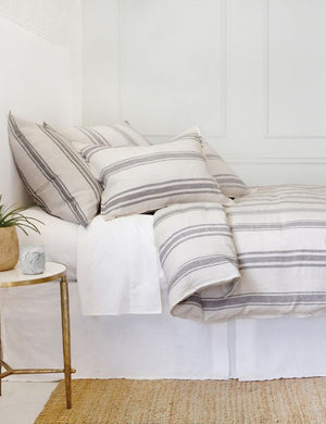 Side view of the Jackson Linen flax and midnight striped Duvet by Pom Pom at Home