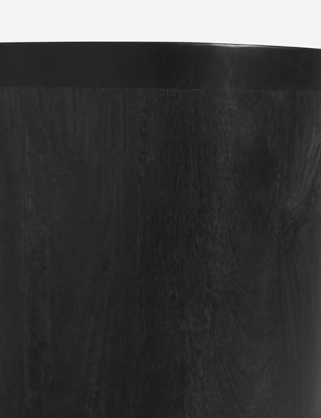 #color::black | Detailed shot of the black mango wood on the Luna black mango wood oval console table.