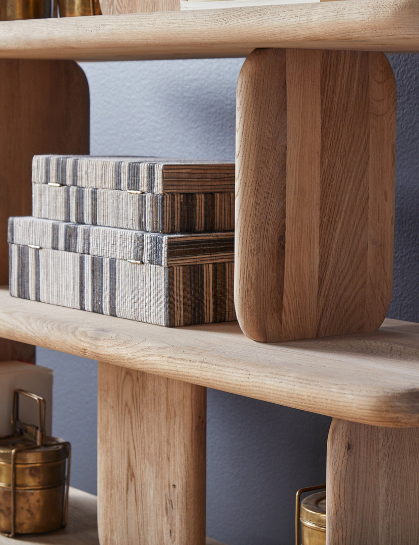 #color::natural | Angled close up of the Nera natural solid wood sculptural bookcase