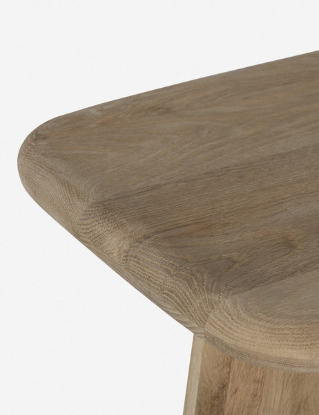 #color::natural | Close-up of the left corner on the Nera natural wood sculptural console table