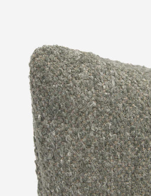 Corner-shot of the manon linen moss green square boucle pillow