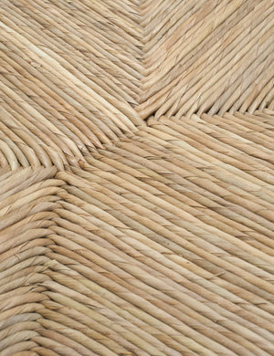 Detailed shot of the woven rattan material on the Nolani arm chair