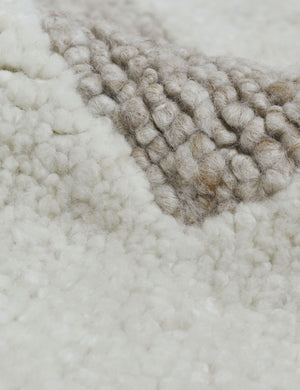Detailed view of the white and brown tones on the Oasis plush geometric neutral-toned rug by Élan Byrd