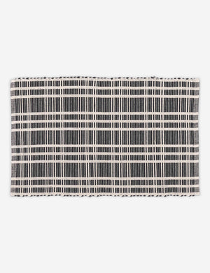 Rika black and white cotton machine washable mat with checkerboard pattern