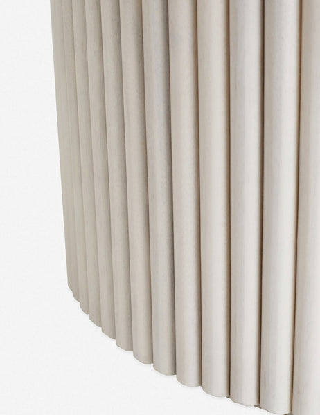 #color::white-wash | Close-up of the textured paneling of the white-washed acacia wood on the bottom of the pedestal base of the Rutherford round dining table.