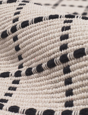 Close-up of the Sebou natural and black dotted machine washable mat