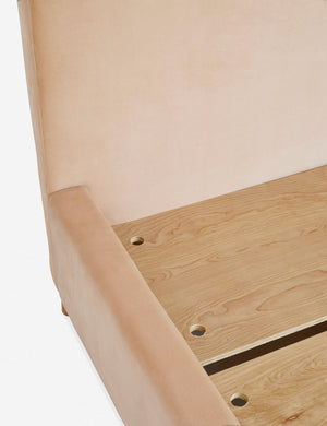 Close-up of the wooden support beams inside the base of the Solene buff pink velvet platform bed