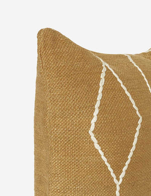Close-up of the corner of the Moroccan ochre and natural beni ourain inspired square flat weave pillow by Sarah Sherman Samuel