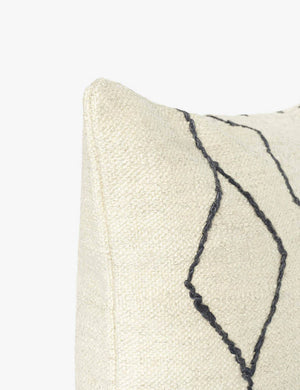 Close-up of the corner of the Moroccan black and natural beni ourain inspired square flat weave pillow by Sarah Sherman Samuel
