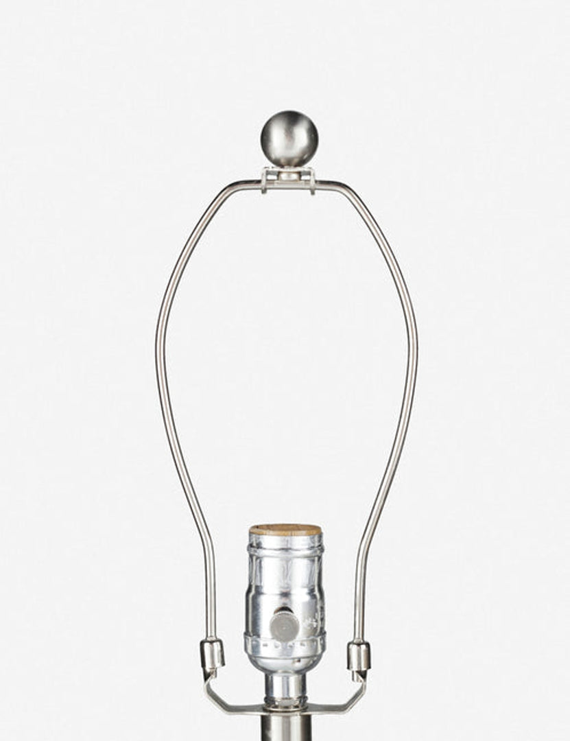 #color::stone | Close-up of the silver light fixture on the Vivienne tan ceramic table lamp with spherical base