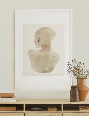 The Sara singh back drop portrait neutral toned wall art by Stampa sits atop a white wooden sideboard with earth-toned bowls and vases